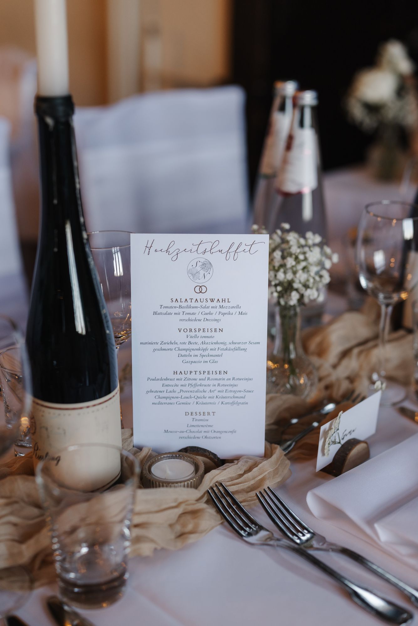 Menu card for the wedding buffet on a set table in the castle