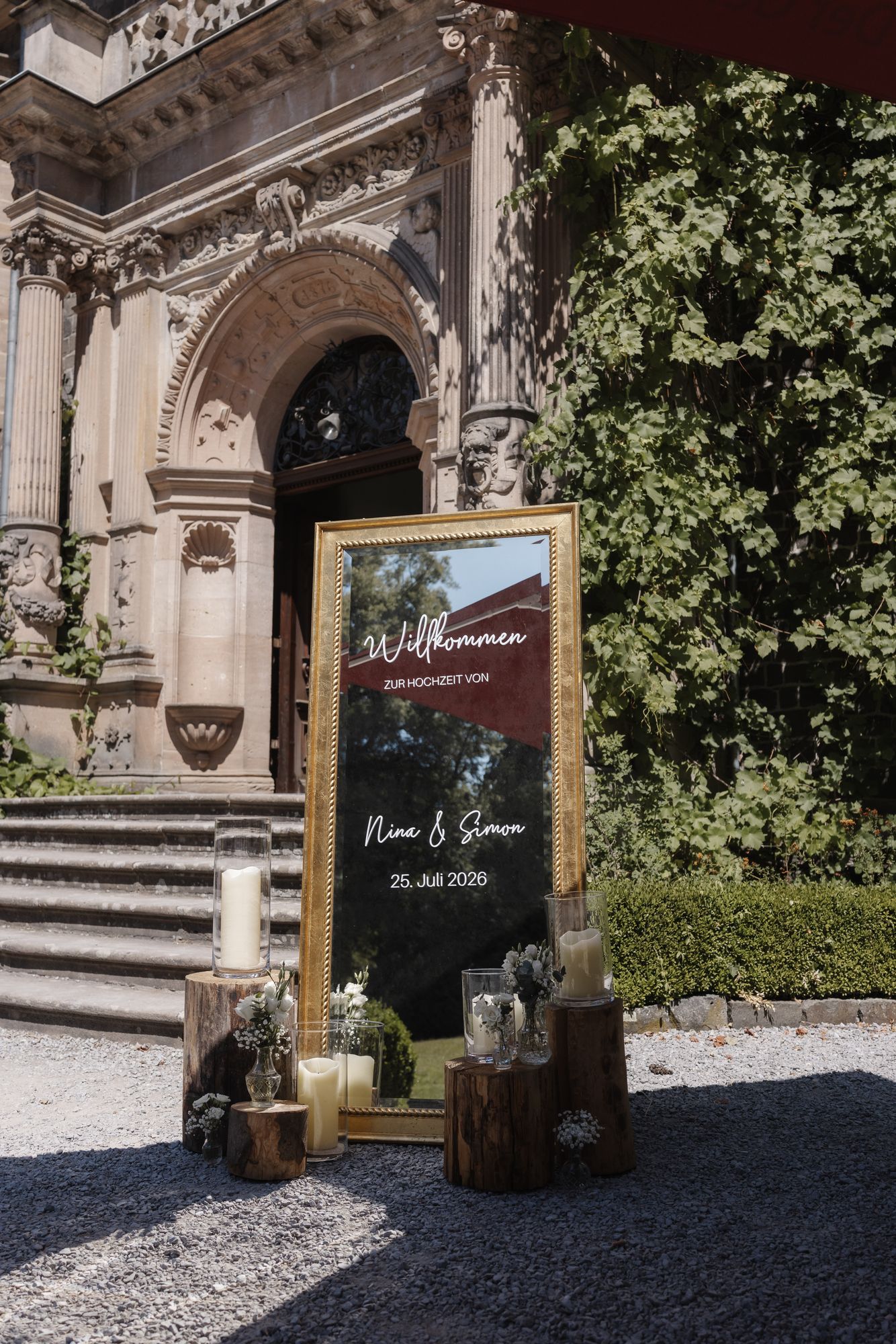 Welcome sign for the wedding guests at the castle stairs